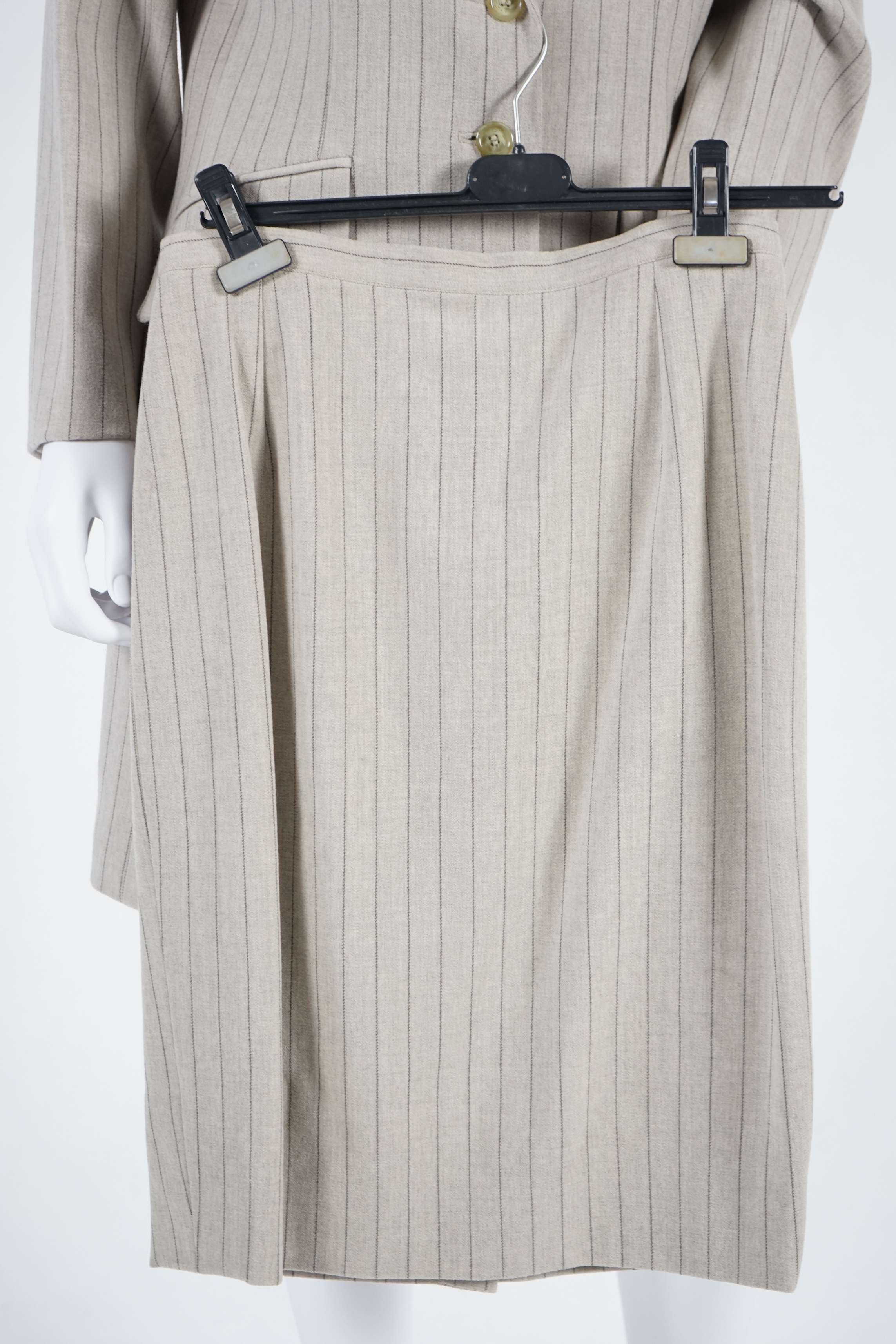 Two vintage Yves Saint Laurent variation lady's suits with matching trousers and skirts, F 40 (UK 12). Please note alterations to make the waist smaller may have been carried out on some of the skirts. Proceeds to Happy